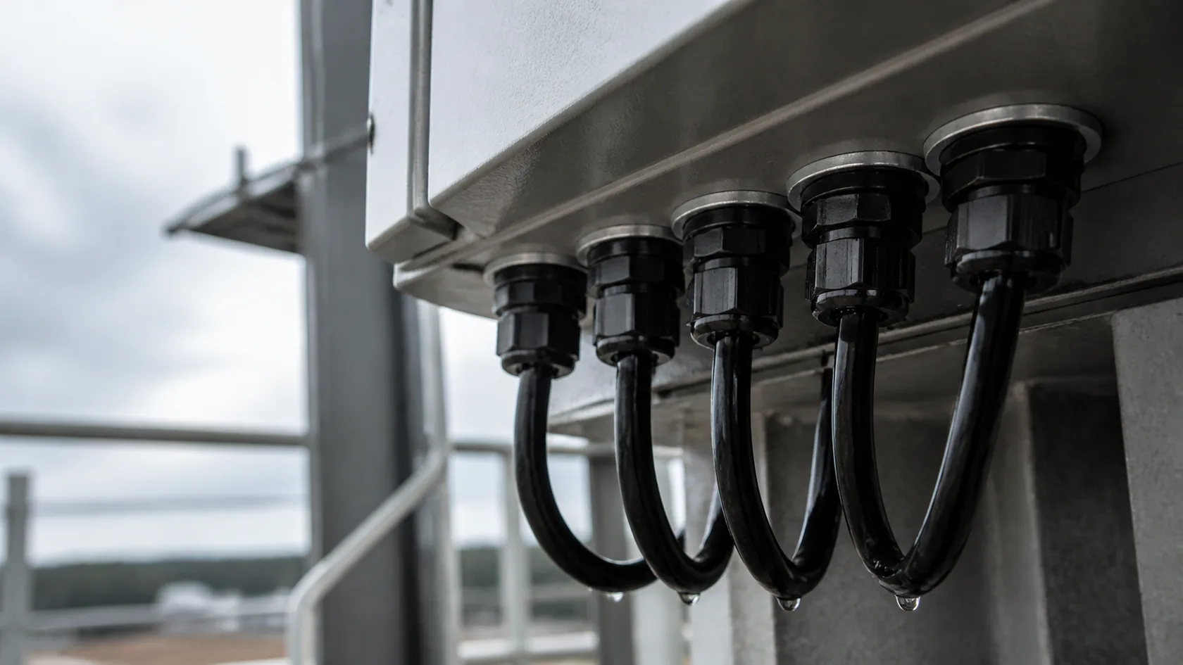 Cable glands and drip loop on an outdoor enclosure