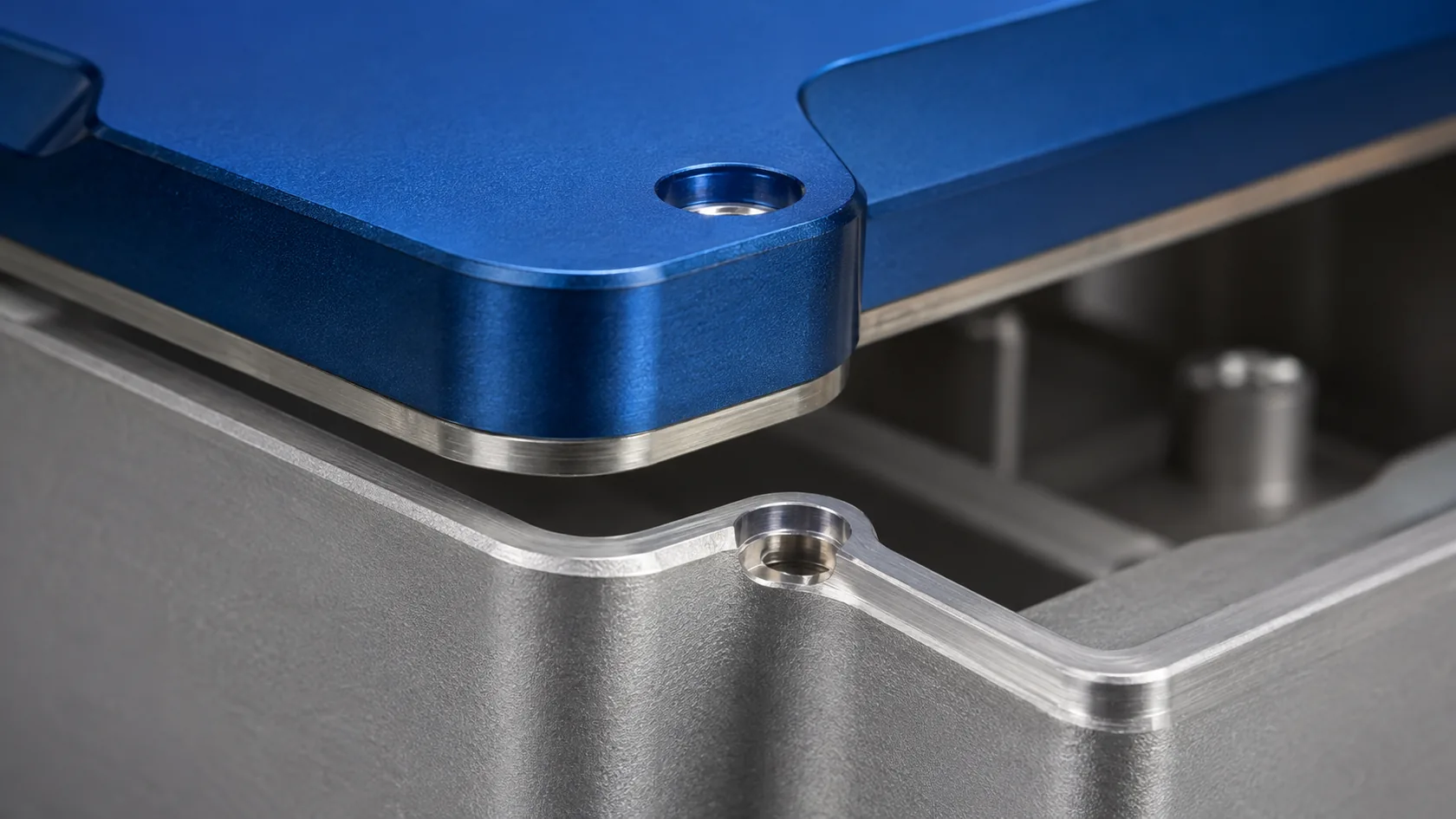 Anodized enclosure body and lid with exposed metal contact areas